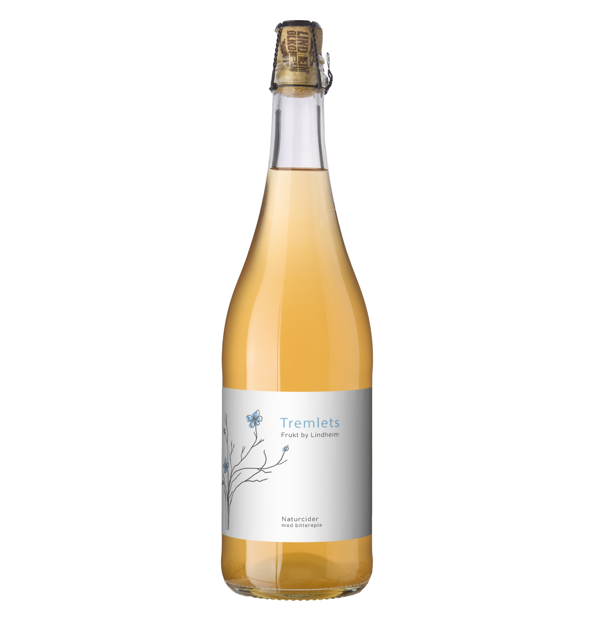 Alt-tekst: Flaske med Tremlets naturcider fra Lindheim, gyllen farge og etikett med blomstemotiv.